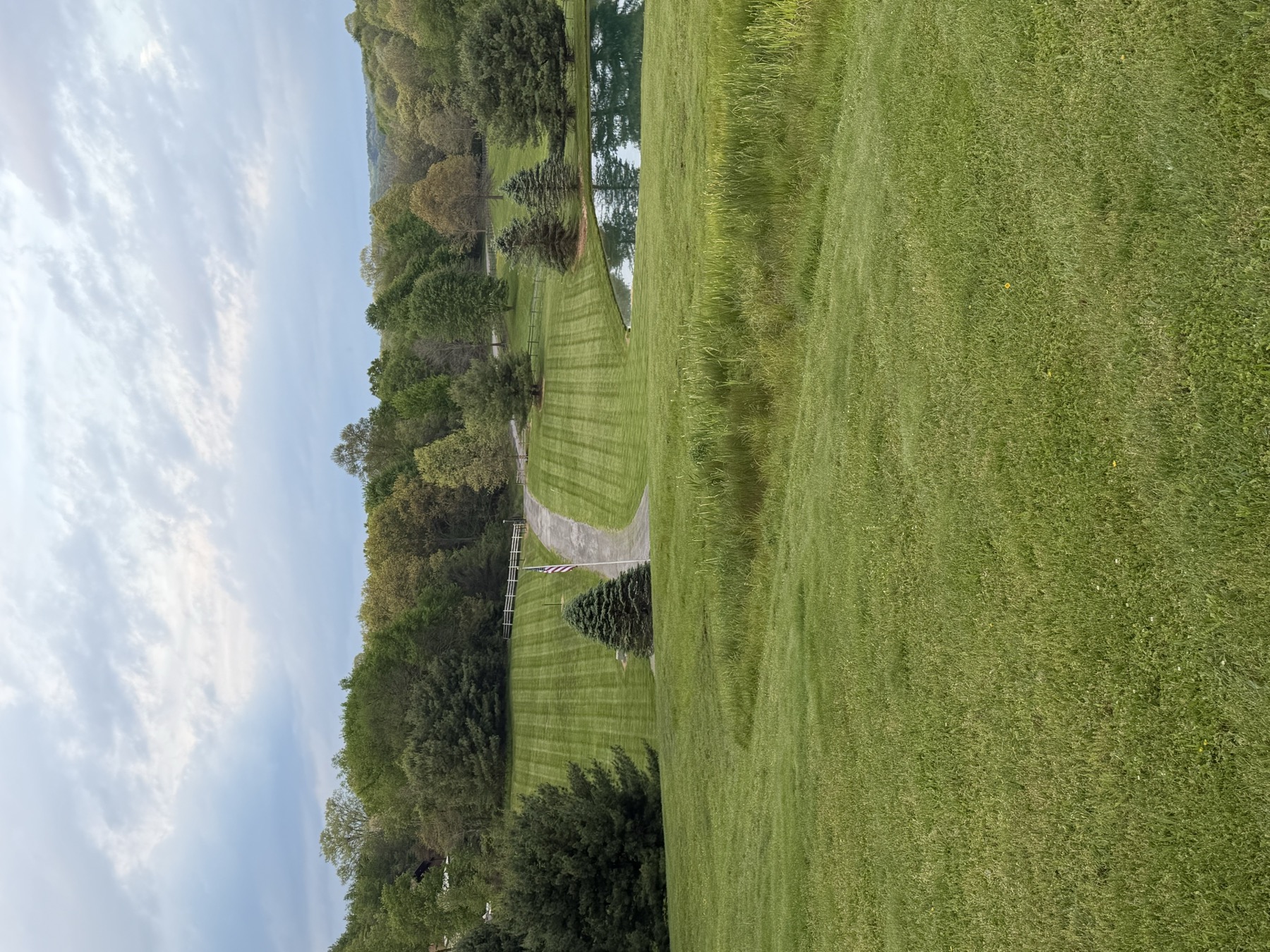 Large grounds surrounding a pond